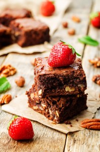 chocolate nut brownie cake decorated with strawberries